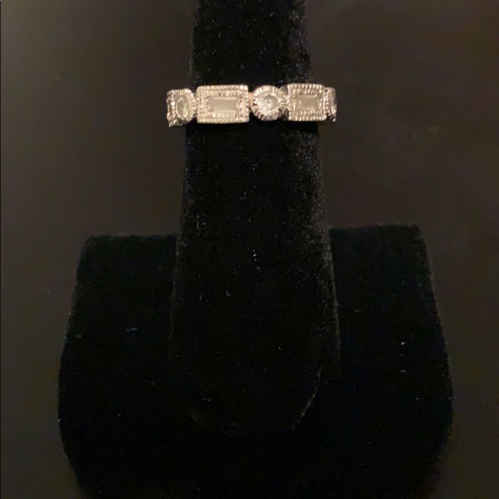 Baguette and round stone ring